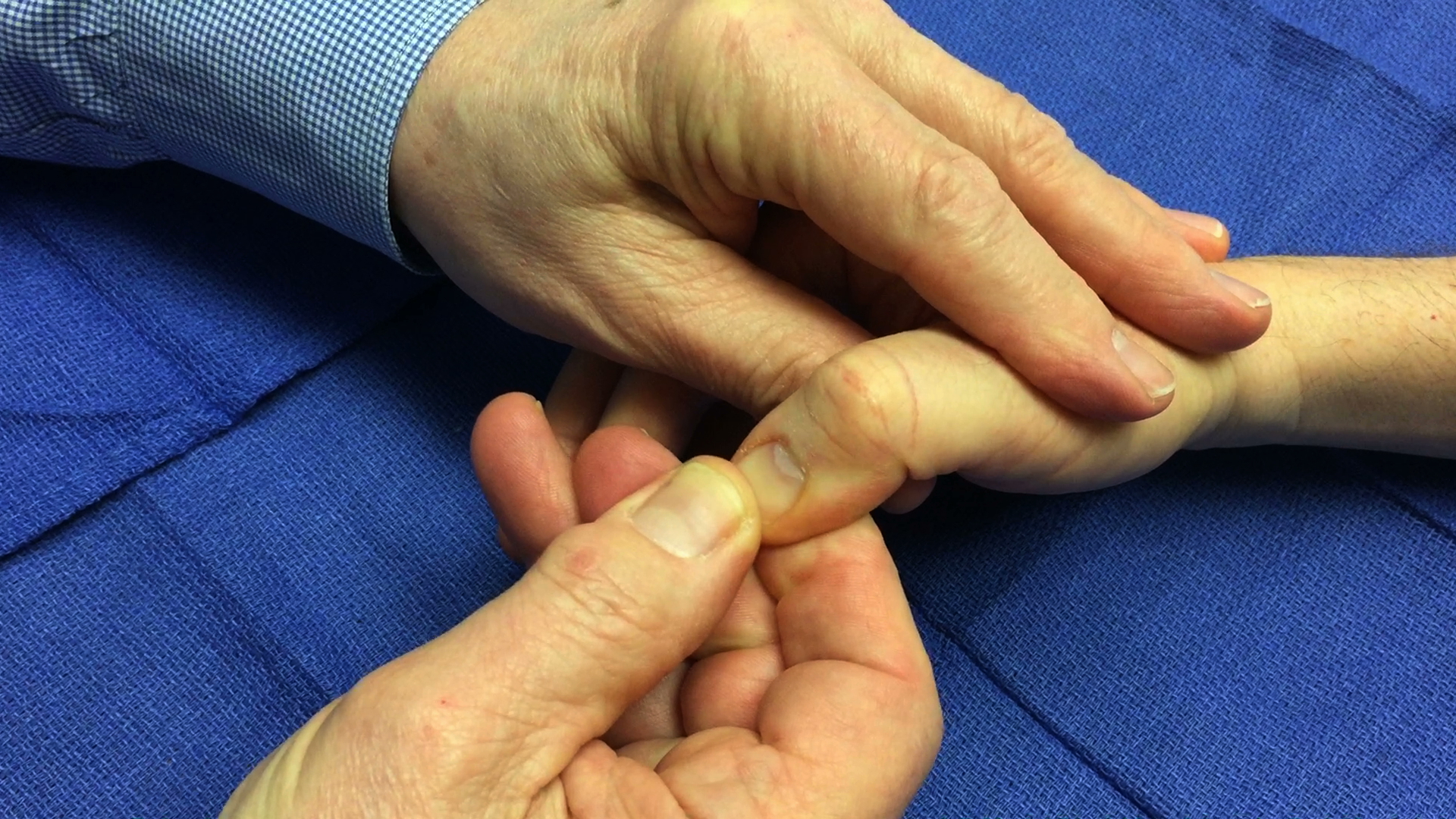 slide your finger distally on the fingernail while maintaining the pressure